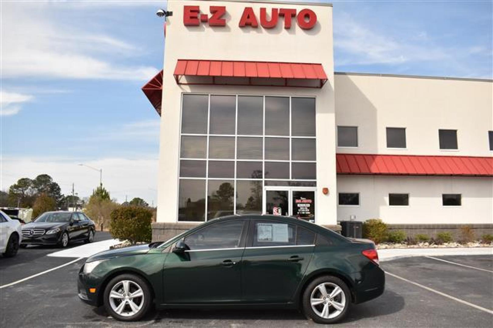 2014 Green Chevrolet Cruze LT 2LT Auto (1G1PE5SB7E7) , 6-Speed Automatic transmission, located at 3900 Bragg Blvd., Fayetteville, NC, 28303, (910) 868-3000, 35.081905, -78.943367 - T-8895-R - 2014 Chevrolet Cruze LT 1G1PE5SB7E7407977 - Photo#0