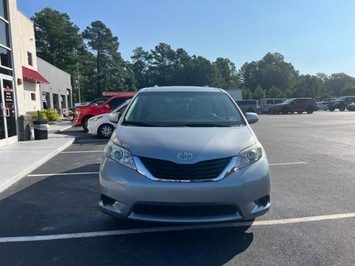 2014 Silver Toyota Sienna LE FWD 8-Passenger V6 (5TDKK3DCXES) , 5-Speed Automatic transmission, located at 3900 Bragg Blvd., Fayetteville, NC, 28303, (910) 868-3000, 35.081905, -78.943367 - T-9412 - 2014 Toyota Sienna 5TDKK3DCXES446248 - Photo#2