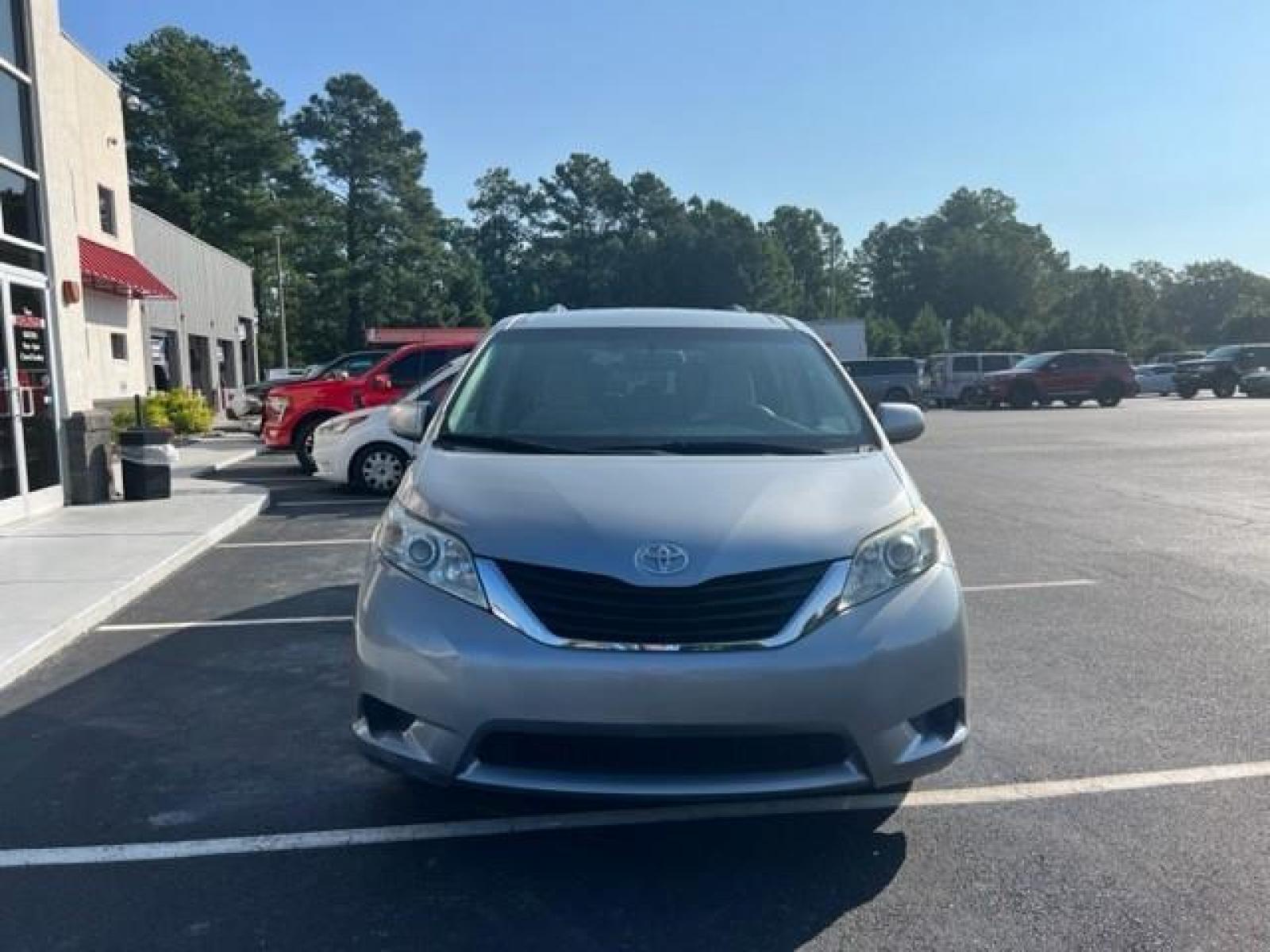 2014 Silver Toyota Sienna LE FWD 8-Passenger V6 (5TDKK3DCXES) , 5-Speed Automatic transmission, located at 3900 Bragg Blvd., Fayetteville, NC, 28303, (910) 868-3000, 35.081905, -78.943367 - T-9412 - 2014 Toyota Sienna 5TDKK3DCXES446248 - Photo #2