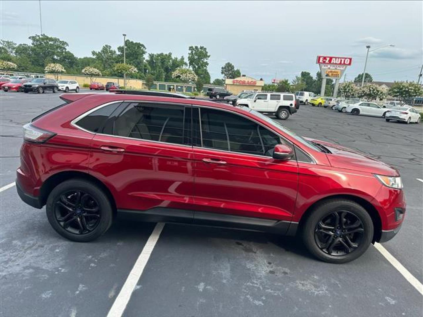 2017 Ruby Red Metallic Tinted Clearcoat Ford Edge Titanium (2FMPK3K96HB) , 6-Speed Automatic transmission, located at 3900 Bragg Blvd., Fayetteville, NC, 28303, (910) 868-3000, 35.081905, -78.943367 - T-9435-R1 - 2017 Ford Edge 2FMPK3K96HBB20476 - Photo#2