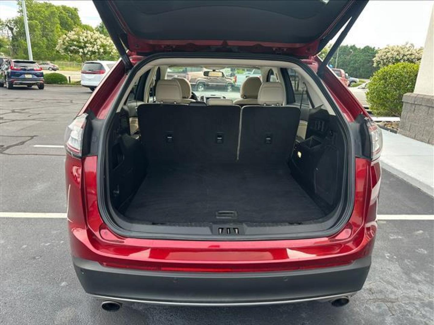 2017 Ruby Red Metallic Tinted Clearcoat Ford Edge Titanium (2FMPK3K96HB) , 6-Speed Automatic transmission, located at 3900 Bragg Blvd., Fayetteville, NC, 28303, (910) 868-3000, 35.081905, -78.943367 - T-9435-R1 - 2017 Ford Edge 2FMPK3K96HBB20476 - Photo#4