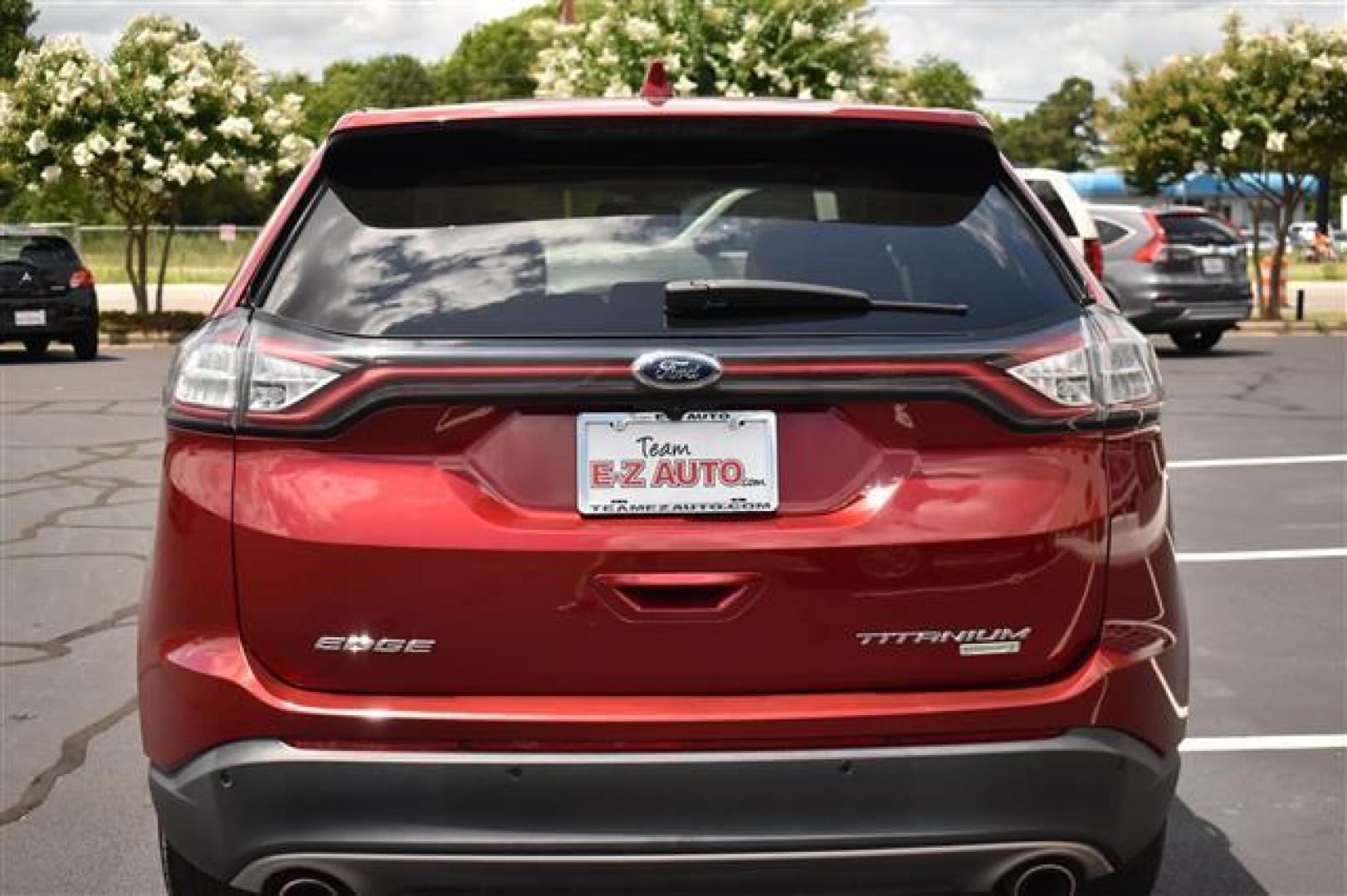 2017 Ruby Red Metallic Tinted Clearcoat Ford Edge Titanium (2FMPK3K96HB) , 6-Speed Automatic transmission, located at 3900 Bragg Blvd., Fayetteville, NC, 28303, (910) 868-3000, 35.081905, -78.943367 - T-9435-R - 2017 Ford Edge 2FMPK3K96HBB20476 - Photo#0