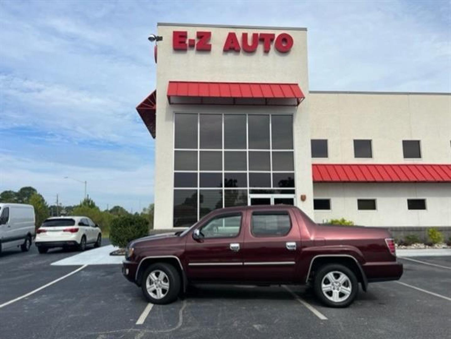 2009 Dark Cherry Pearl Honda Ridgeline RTL (5FPYK165X9B) , 5-Speed Automatic transmission, located at 3900 Bragg Blvd., Fayetteville, NC, 28303, (910) 868-3000, 35.081905, -78.943367 - T-9472 - 2009 Honda Ridgeline 5FPYK165X9B105334 - Photo#0