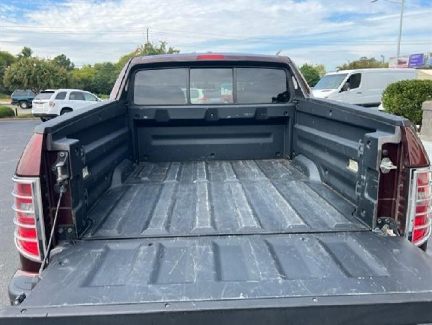 2009 Dark Cherry Pearl Honda Ridgeline RTL (5FPYK165X9B) , 5-Speed Automatic transmission, located at 3900 Bragg Blvd., Fayetteville, NC, 28303, (910) 868-3000, 35.081905, -78.943367 - T-9472 - 2009 Honda Ridgeline 5FPYK165X9B105334 - Photo#4