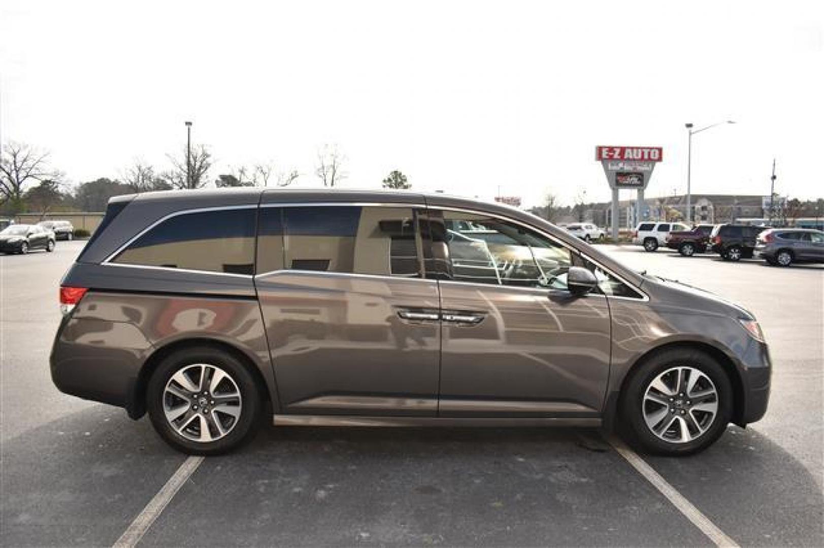 2014 Smoky Topaz Metallic /Brown Honda Odyssey Touring (5FNRL5H9XEB) , 6-Speed Automatic transmission, located at 3900 Bragg Blvd., Fayetteville, NC, 28303, (910) 868-3000, 35.081905, -78.943367 - T-9505 - 2014 Honda Odyssey 5FNRL5H9XEB070080 - Photo#1