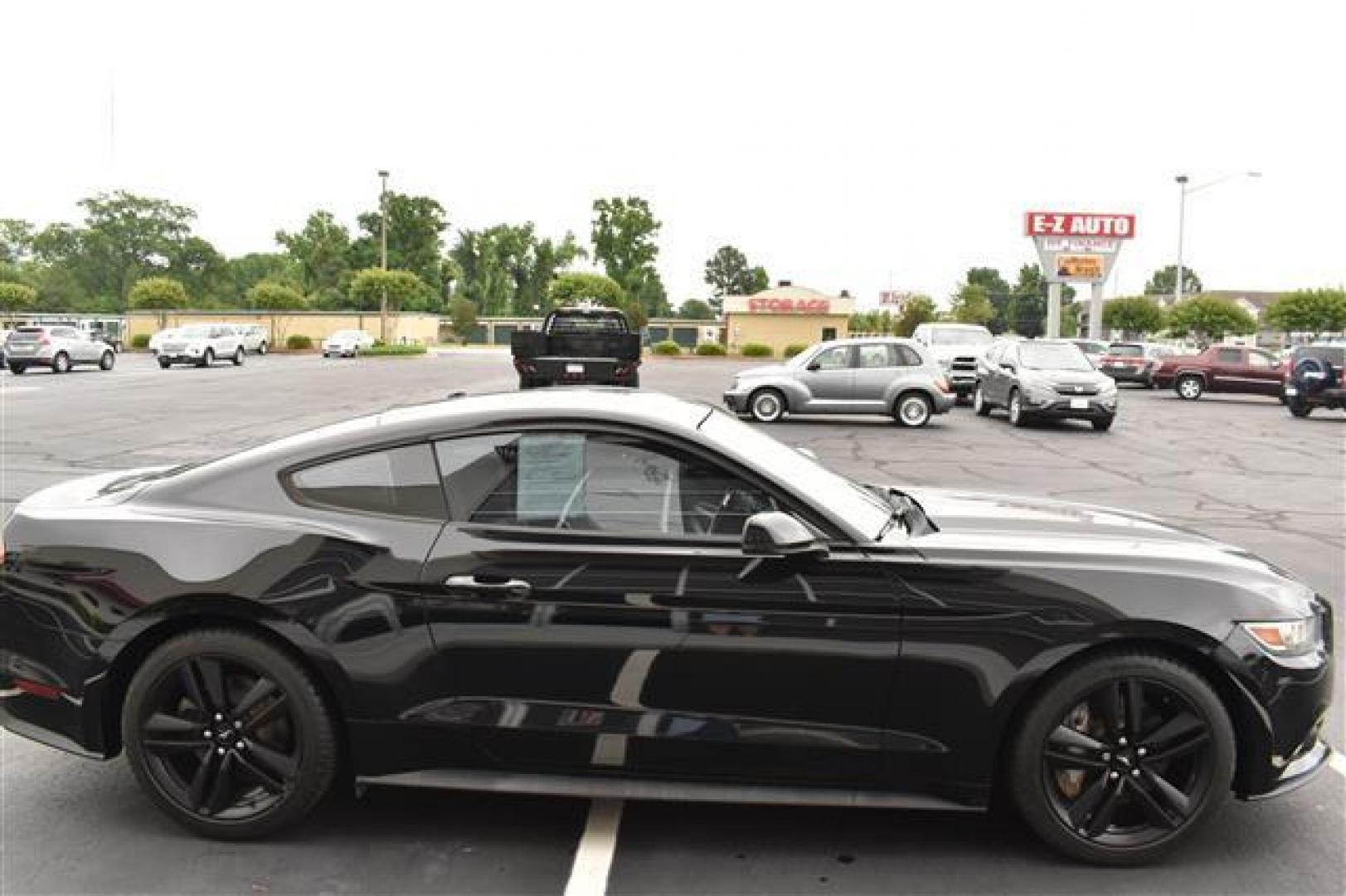 2015 Black Ford Mustang EcoBoost Premium Coupe (1FA6P8TH9F5) , 6-Speed Automatic transmission, located at 3900 Bragg Blvd., Fayetteville, NC, 28303, (910) 868-3000, 35.081905, -78.943367 - T-9527 - 2015 Ford Mustang 1FA6P8TH9F5418581 - Photo#1