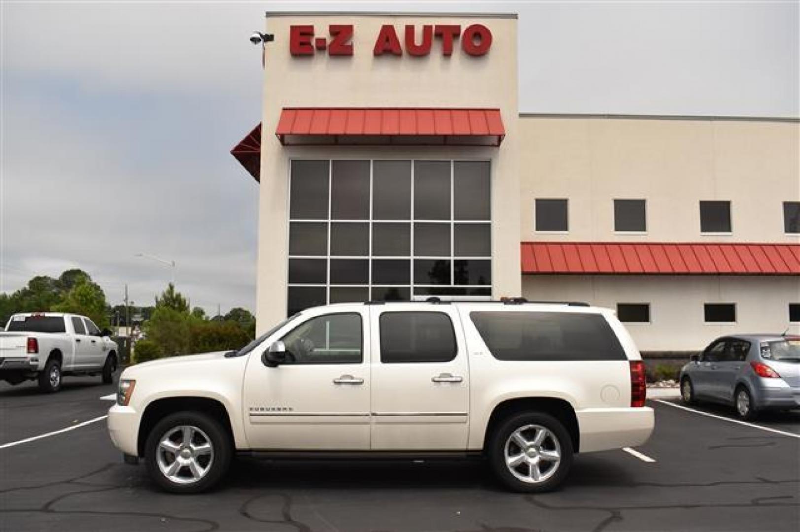 2011 White Diamond Chevrolet Suburban LTZ 1500 4WD (1GNSKKE37BR) , 6-Speed Automatic transmission, located at 3900 Bragg Blvd., Fayetteville, NC, 28303, (910) 868-3000, 35.081905, -78.943367 - Photo#0