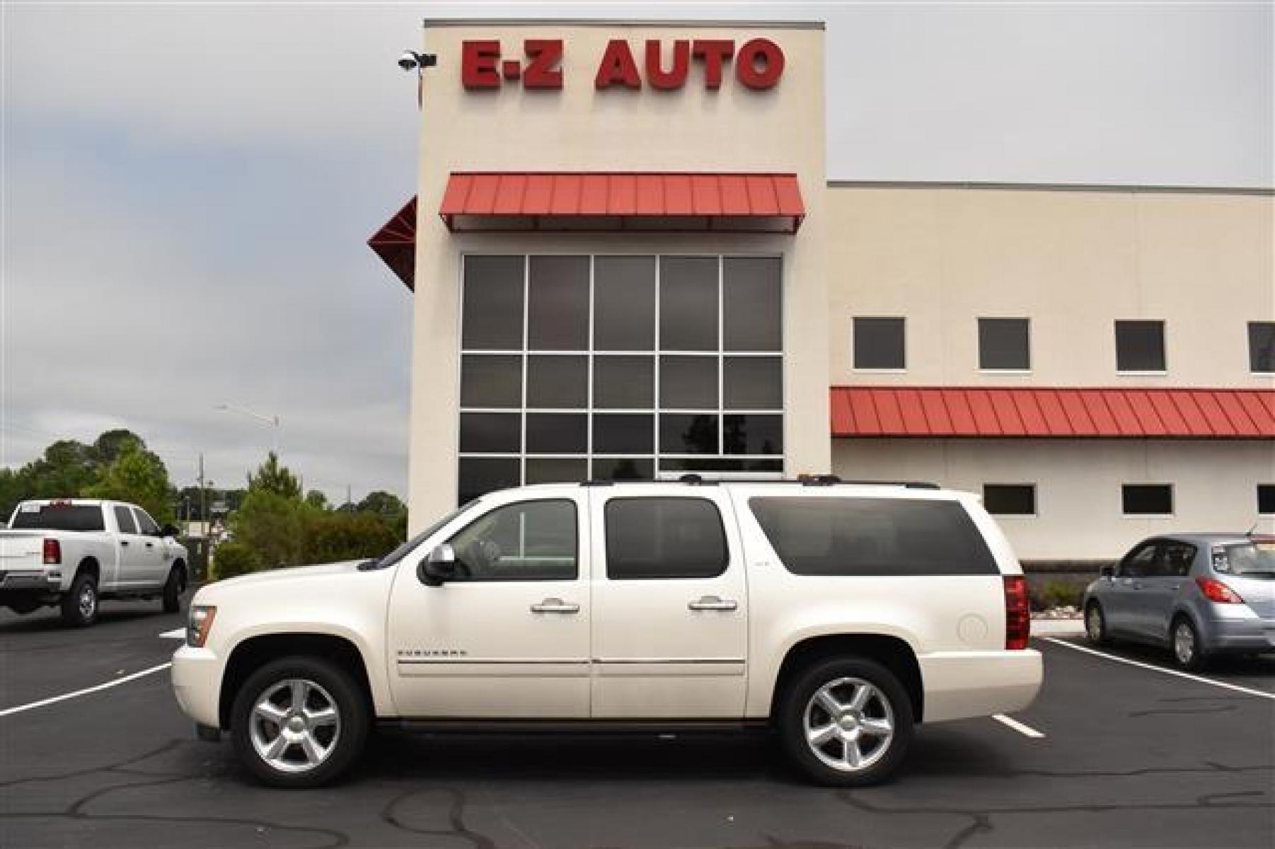 2011 White Diamond Chevrolet Suburban LTZ 1500 4WD (1GNSKKE37BR) , 6-Speed Automatic transmission, located at 3900 Bragg Blvd., Fayetteville, NC, 28303, (910) 868-3000, 35.081905, -78.943367 - T-9576 - 2011 Chevrolet Suburban 1GNSKKE37BR177684 - Photo #0