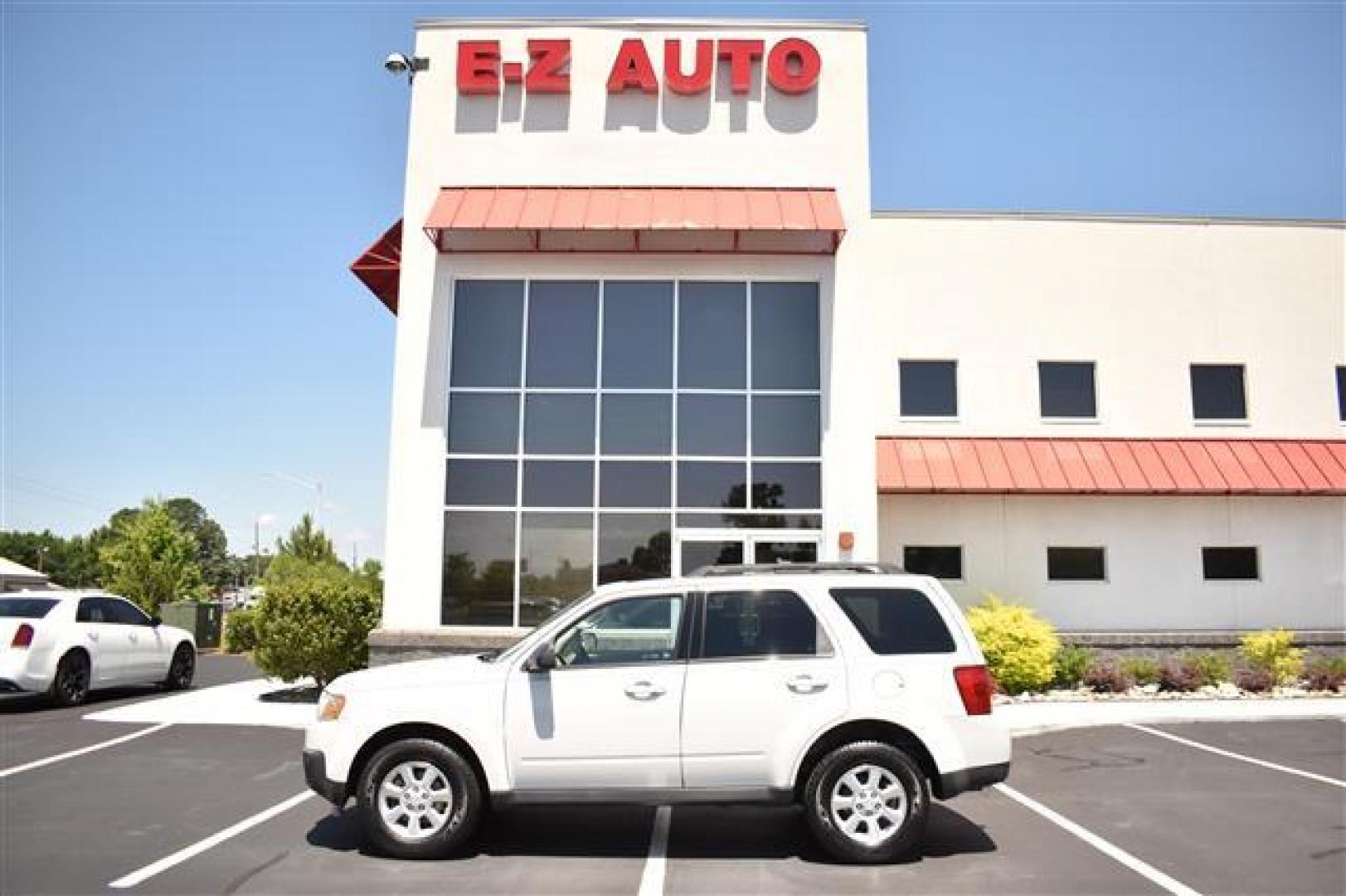 2009 White Suede Mazda Tribute i Touring FWD (4F2CZ02709K) , 4-Speed Automatic transmission, located at 3900 Bragg Blvd., Fayetteville, NC, 28303, (910) 868-3000, 35.081905, -78.943367 - T-9594 - 2009 Mazda Tribute 4F2CZ02709KM00140 - Photo#0