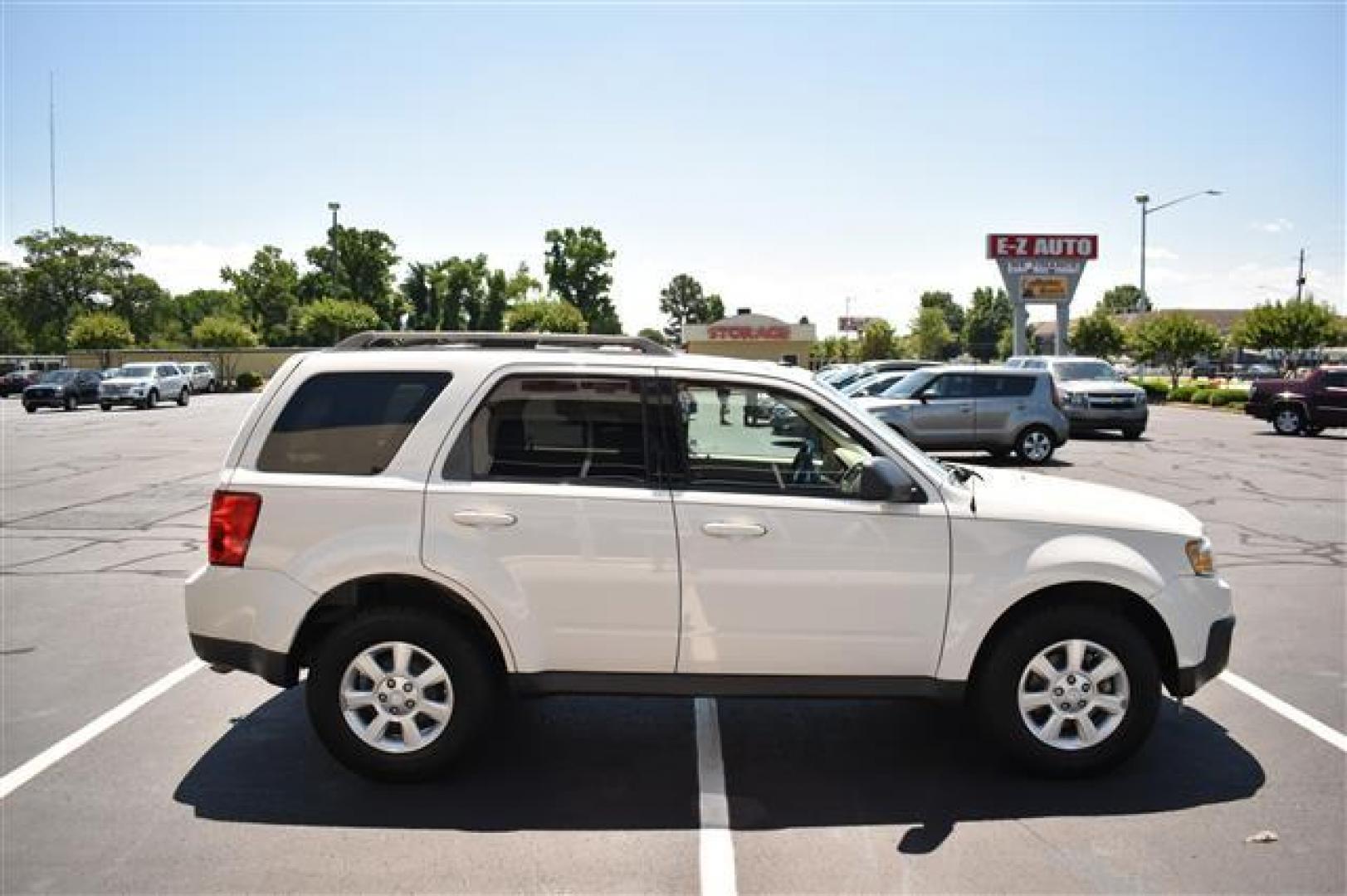 2009 White Suede Mazda Tribute i Touring FWD (4F2CZ02709K) , 4-Speed Automatic transmission, located at 3900 Bragg Blvd., Fayetteville, NC, 28303, (910) 868-3000, 35.081905, -78.943367 - T-9594 - 2009 Mazda Tribute 4F2CZ02709KM00140 - Photo#1