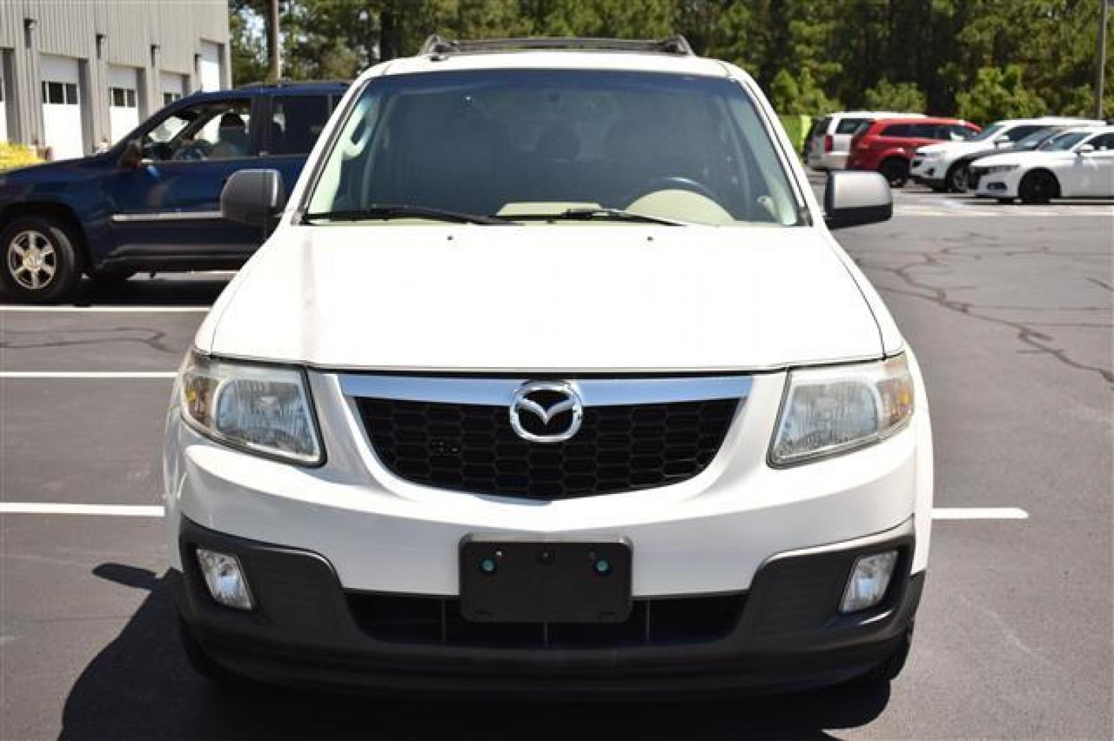 2009 White Suede Mazda Tribute i Touring FWD (4F2CZ02709K) , 4-Speed Automatic transmission, located at 3900 Bragg Blvd., Fayetteville, NC, 28303, (910) 868-3000, 35.081905, -78.943367 - T-9594 - 2009 Mazda Tribute 4F2CZ02709KM00140 - Photo#2