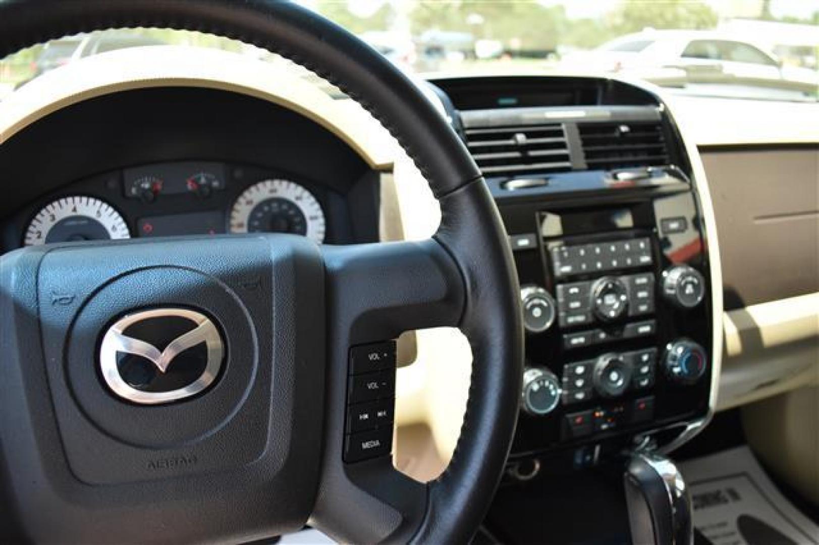 2009 White Suede Mazda Tribute i Touring FWD (4F2CZ02709K) , 4-Speed Automatic transmission, located at 3900 Bragg Blvd., Fayetteville, NC, 28303, (910) 868-3000, 35.081905, -78.943367 - T-9594 - 2009 Mazda Tribute 4F2CZ02709KM00140 - Photo#7