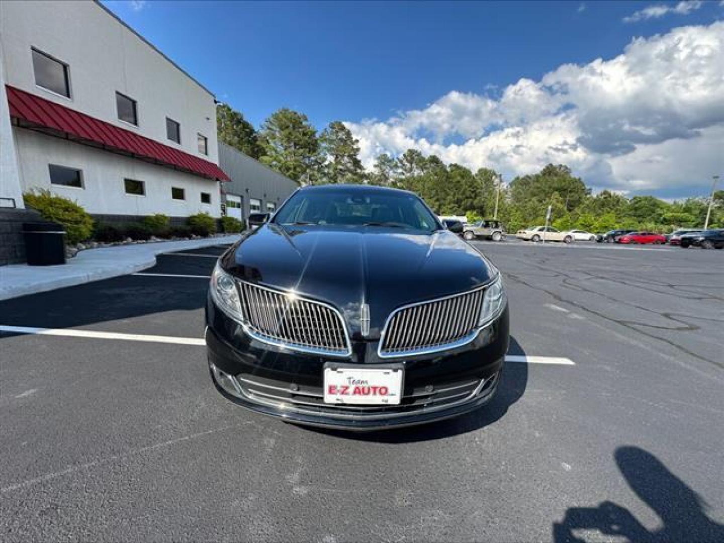 2016 Black Velvet Metallic Lincoln MKS FWD (1LNHL9DK7GG) , 6-Speed Automatic transmission, located at 3900 Bragg Blvd., Fayetteville, NC, 28303, (910) 868-3000, 35.081905, -78.943367 - T-9806 - 2016 Lincoln MKS 1LNHL9DK7GG603406 - Photo#1