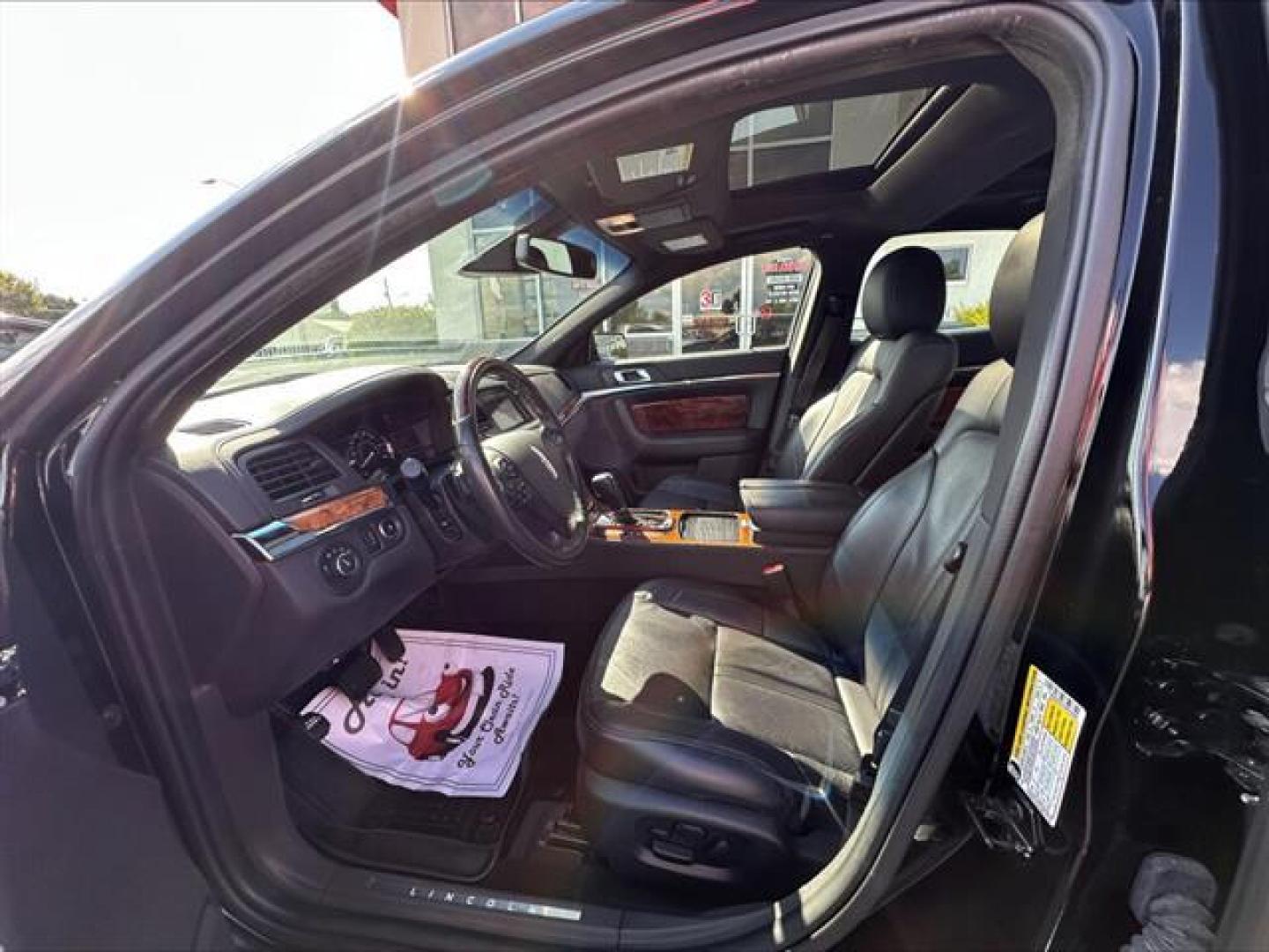 2016 Black Velvet Metallic Lincoln MKS FWD (1LNHL9DK7GG) , 6-Speed Automatic transmission, located at 3900 Bragg Blvd., Fayetteville, NC, 28303, (910) 868-3000, 35.081905, -78.943367 - T-9806 - 2016 Lincoln MKS 1LNHL9DK7GG603406 - Photo#6