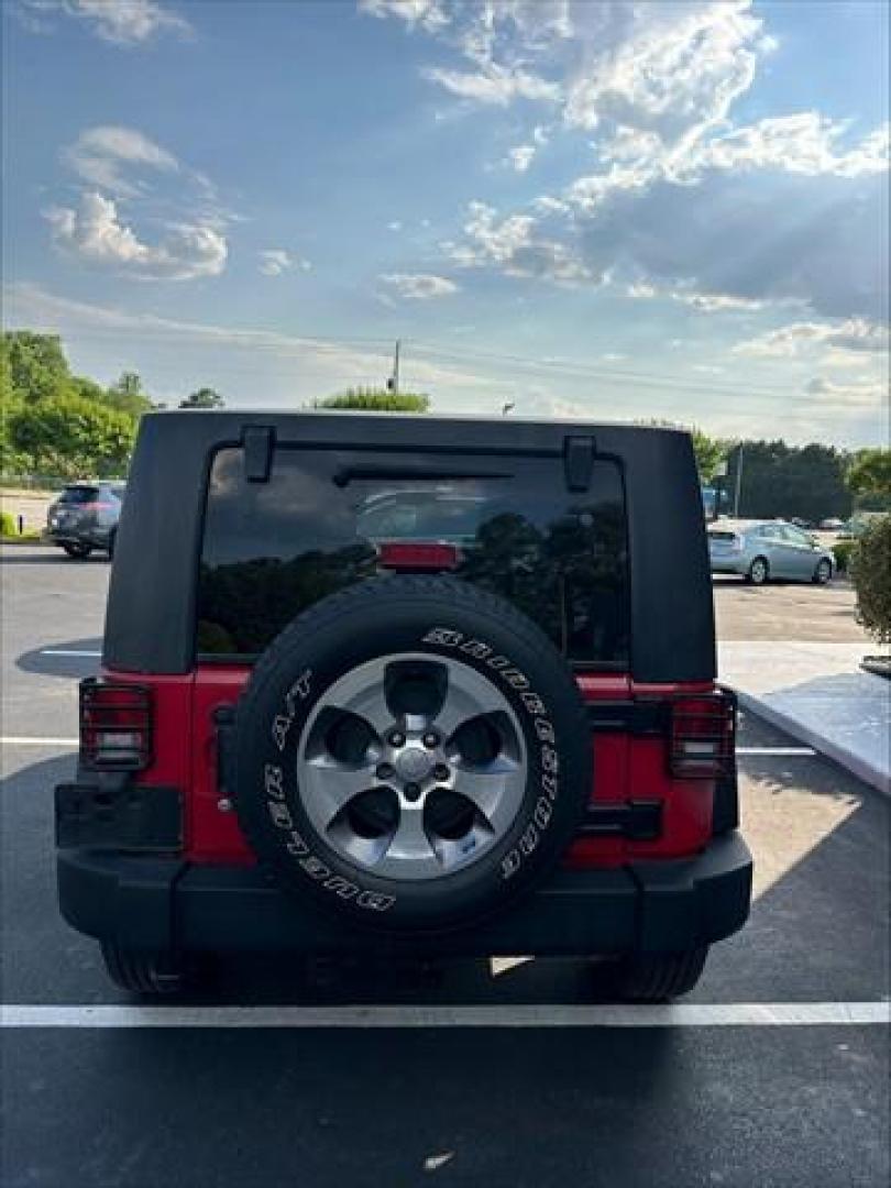 2012 Flame Red with Black Hard Top Jeep Wrangler Unlimited Sport 4WD (1C4BJWDG1CL) , 5-Speed Automatic transmission, located at 3900 Bragg Blvd., Fayetteville, NC, 28303, (910) 868-3000, 35.081905, -78.943367 - C-1 - 2012 Jeep Wrangler 1C4BJWDG1CL120263 - Photo#2