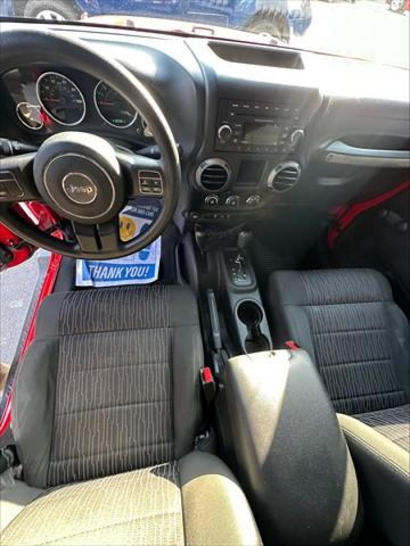 2012 Flame Red with Black Hard Top Jeep Wrangler Unlimited Sport 4WD (1C4BJWDG1CL) , 5-Speed Automatic transmission, located at 3900 Bragg Blvd., Fayetteville, NC, 28303, (910) 868-3000, 35.081905, -78.943367 - C-1 - 2012 Jeep Wrangler 1C4BJWDG1CL120263 - Photo#5