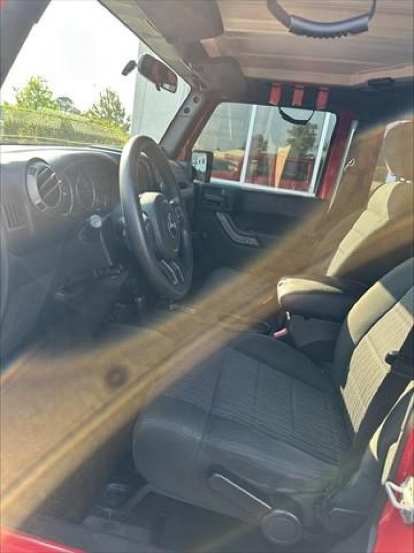 2012 Flame Red with Black Hard Top Jeep Wrangler Unlimited Sport 4WD (1C4BJWDG1CL) , 5-Speed Automatic transmission, located at 3900 Bragg Blvd., Fayetteville, NC, 28303, (910) 868-3000, 35.081905, -78.943367 - C-1 - 2012 Jeep Wrangler 1C4BJWDG1CL120263 - Photo#6