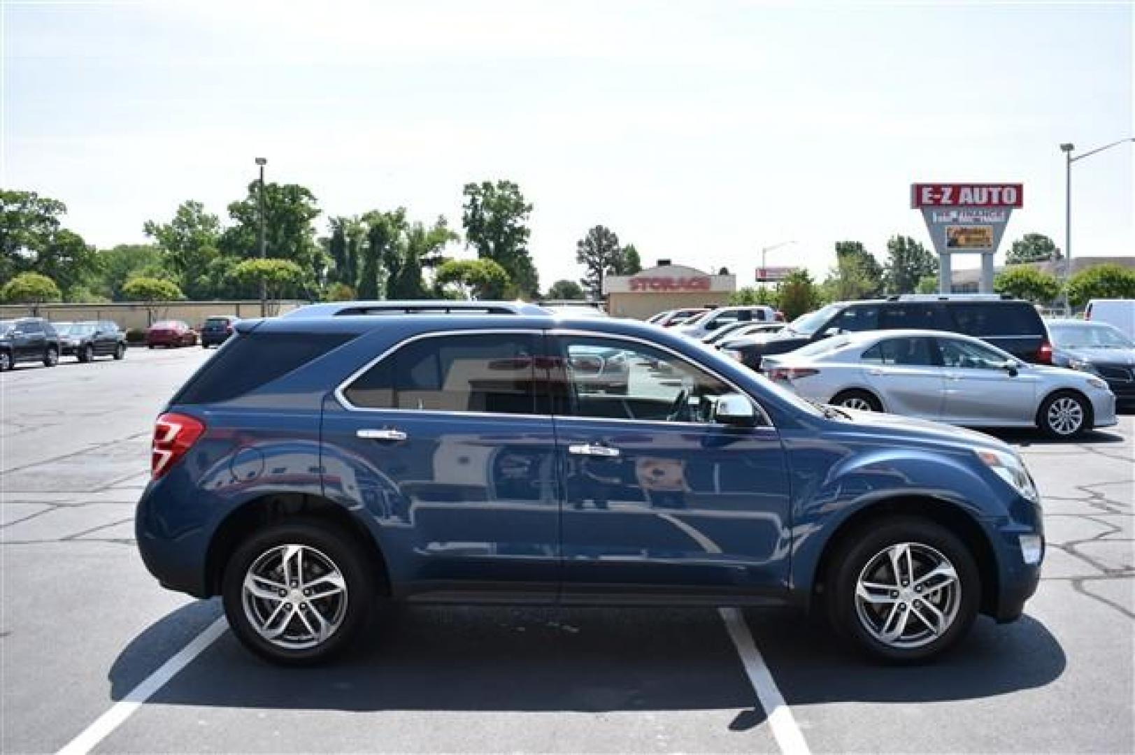 2017 Blue /Tan and Brown Chevrolet Equinox Premier 2WD (2GNALDEK9H6) , 6-Speed Automatic transmission, located at 3900 Bragg Blvd., Fayetteville, NC, 28303, (910) 868-3000, 35.081905, -78.943367 - T-9827 - 2017 Chevrolet Equinox 2GNALDEK9H6208840 - Photo#2