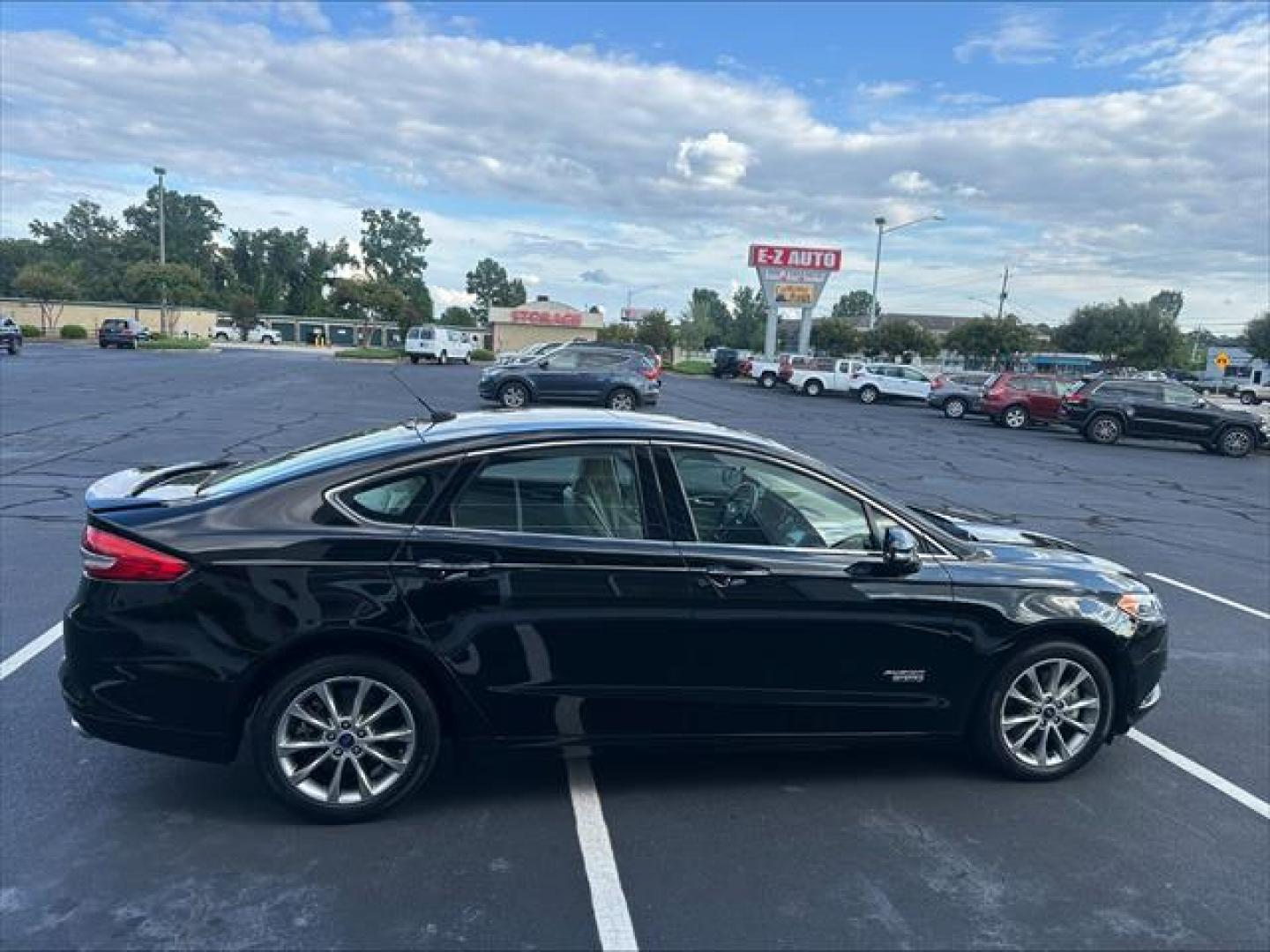 2017 Black Ford Fusion Energi Titanium (3FA6P0SU5HR) , Continuously Variable Transmission transmission, located at 3900 Bragg Blvd., Fayetteville, NC, 28303, (910) 868-3000, 35.081905, -78.943367 - T-9846 - 2017 Ford Fusion Energi 3FA6P0SU5HR328201 - Photo#2