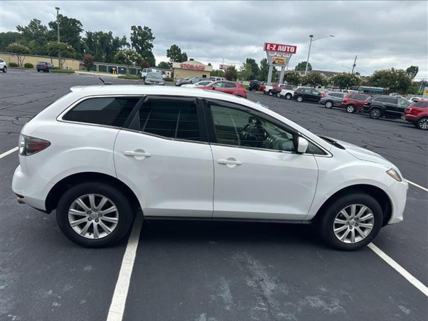 2011 Crystal White Pearl Mazda CX-7 i Touring (JM3ER2C53B0) , 6-Speed Automatic transmission, located at 3900 Bragg Blvd., Fayetteville, NC, 28303, (910) 868-3000, 35.081905, -78.943367 - T-9863 - 2011 Mazda CX-7 JM3ER2C53B0399978 - Photo#2