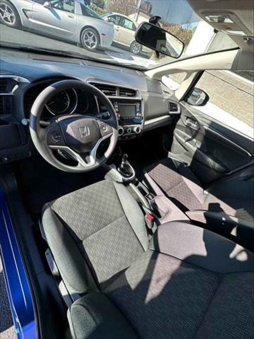 2015 Aegean Blue Metallic Honda Fit LX 6-Spd MT (3HGGK5G5XFM) , 6-Speed Manual transmission, located at 3900 Bragg Blvd., Fayetteville, NC, 28303, (910) 868-3000, 35.081905, -78.943367 - T-9939 - 2015 Honda Fit 3HGGK5G5XFM743845 - Photo#5