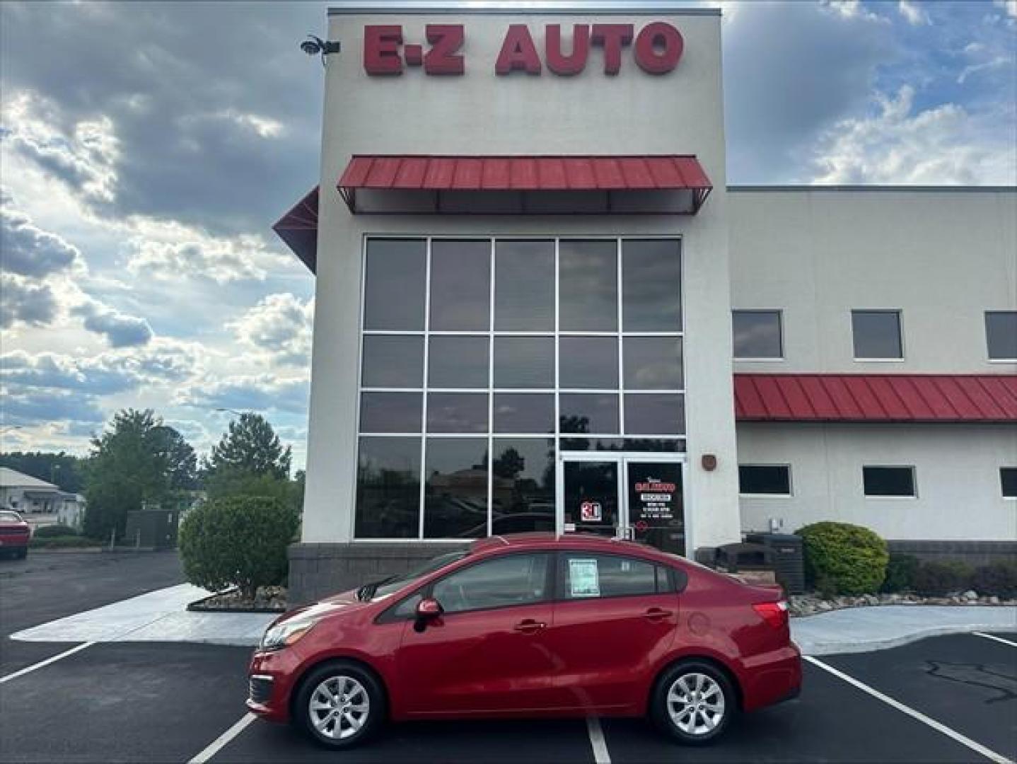 2017 Signal Red Kia Rio LX 6A (KNADM4A37H6) , 6-Speed Automatic transmission, located at 3900 Bragg Blvd., Fayetteville, NC, 28303, (910) 868-3000, 35.081905, -78.943367 - T-9993 - 2017 Kia Rio KNADM4A37H6015588- Photo#0