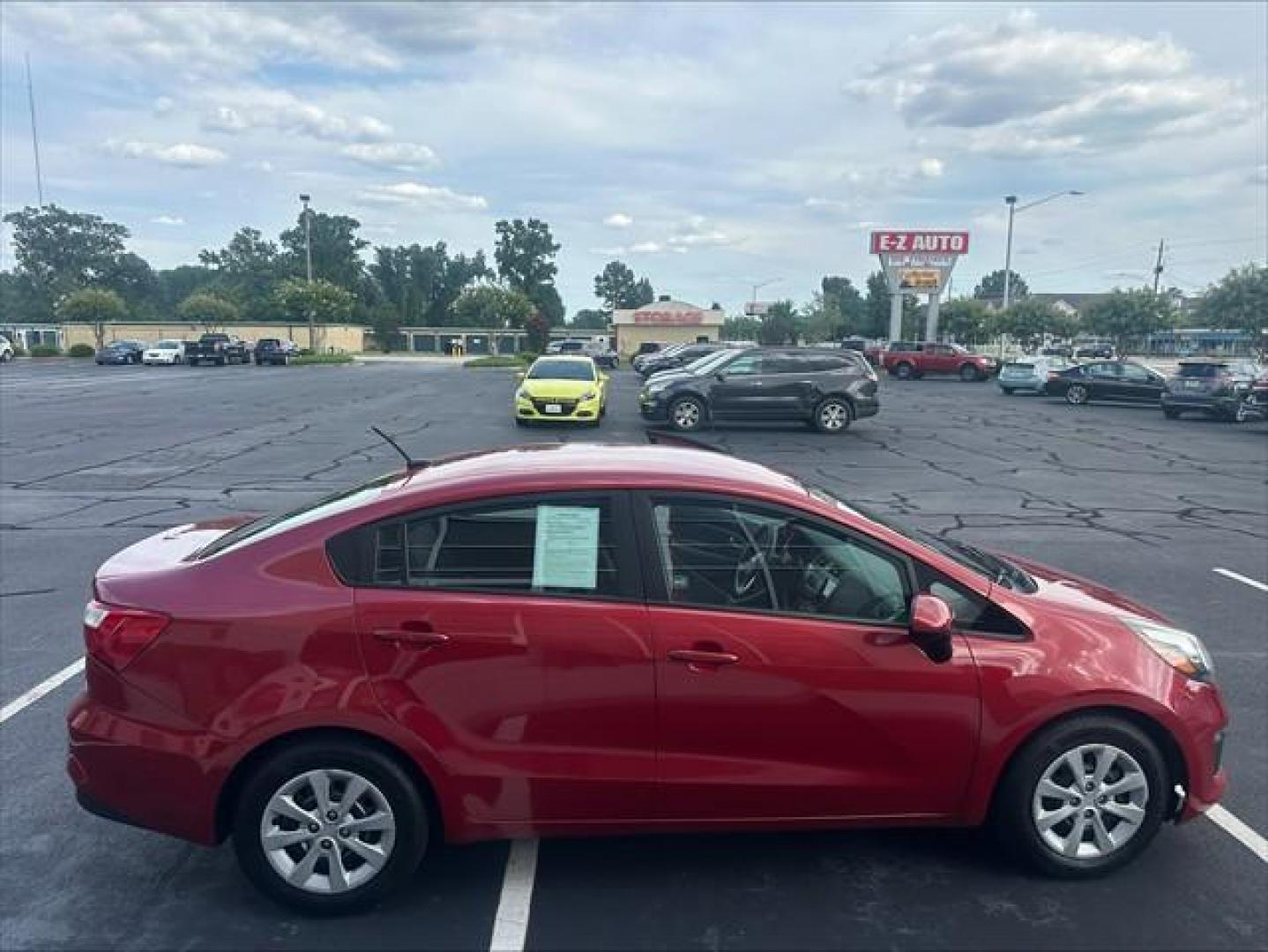 2017 Signal Red Kia Rio LX 6A (KNADM4A37H6) , 6-Speed Automatic transmission, located at 3900 Bragg Blvd., Fayetteville, NC, 28303, (910) 868-3000, 35.081905, -78.943367 - T-9993 - 2017 Kia Rio KNADM4A37H6015588- Photo#2