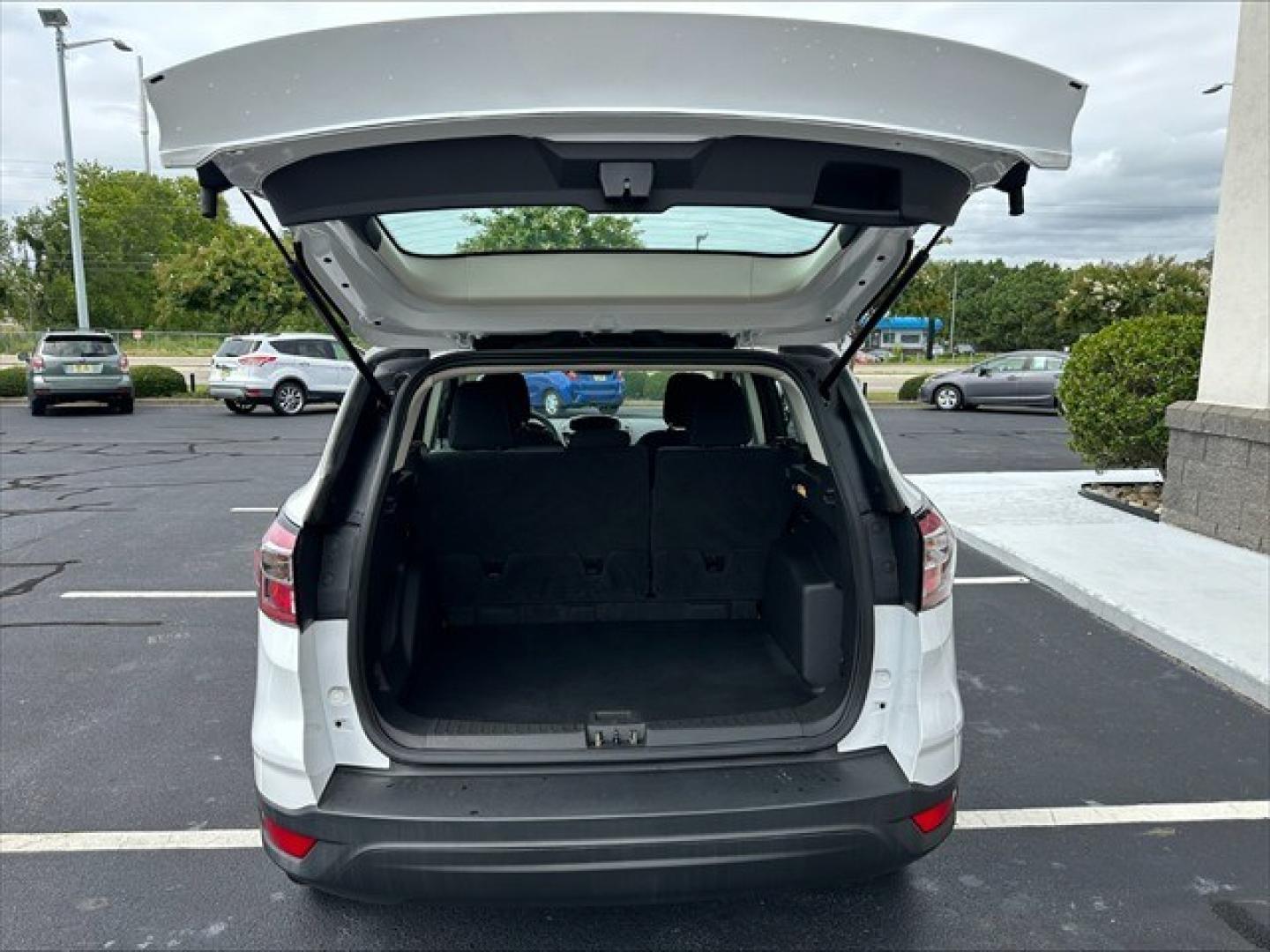2018 Oxford White Ford Escape S FWD (1FMCU0F74JU) , 6-Speed Automatic transmission, located at 3900 Bragg Blvd., Fayetteville, NC, 28303, (910) 868-3000, 35.081905, -78.943367 - T-10009 - 2018 Ford Escape 1FMCU0F74JUB35073- Photo#4
