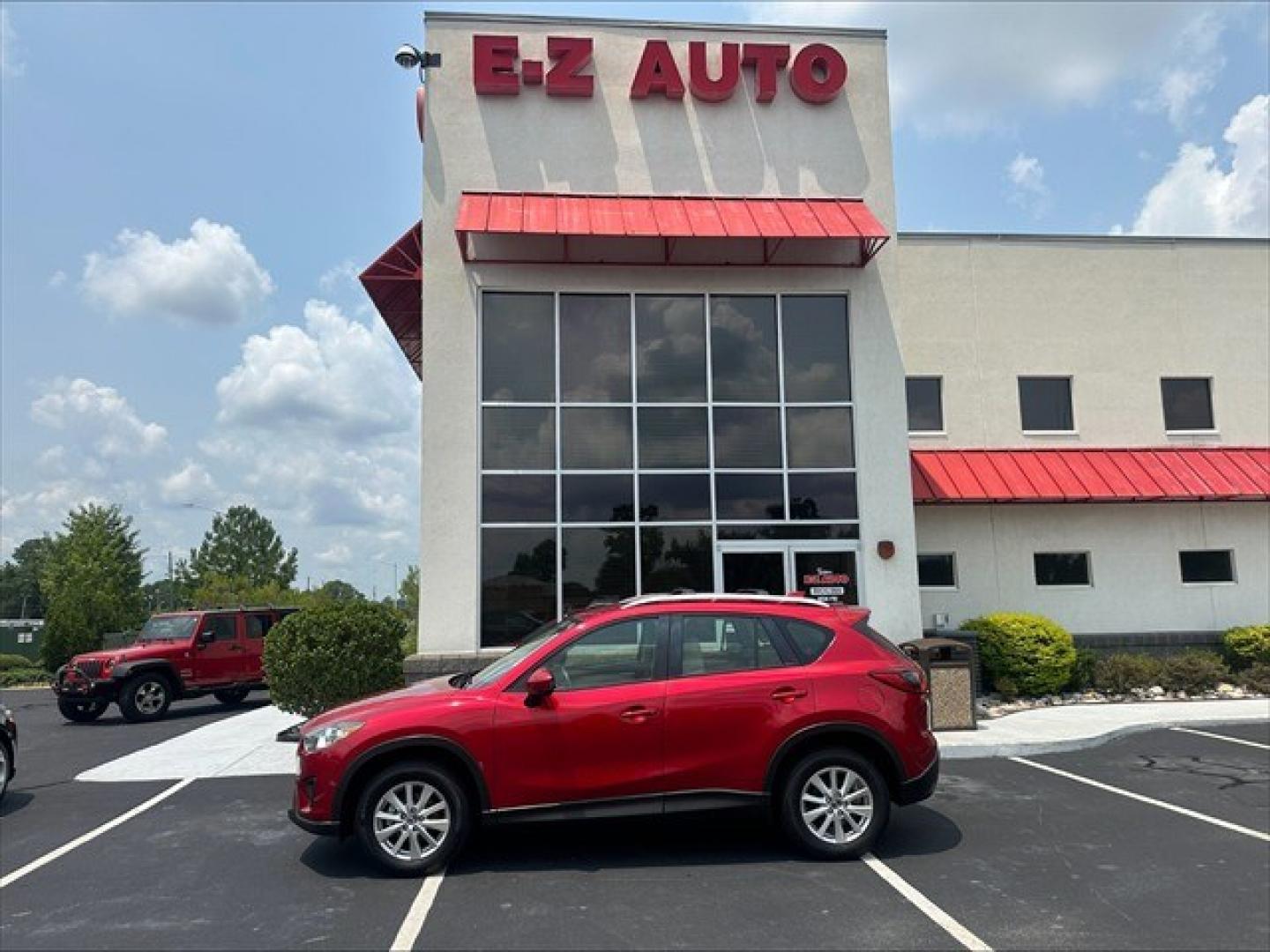 2015 Soul Red Mazda CX-5 Sport AT (JM3KE2BE0F0) , 6-Speed Automatic transmission, located at 3900 Bragg Blvd., Fayetteville, NC, 28303, (910) 868-3000, 35.081905, -78.943367 - T-10019 - 2015 Mazda CX-5 JM3KE2BE0F0457938- Photo#0